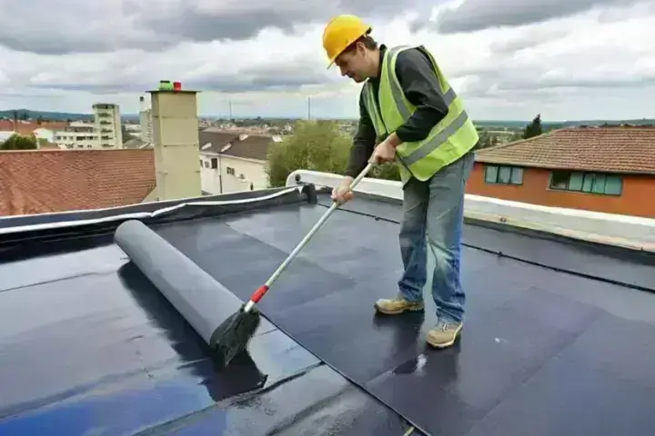 Image of applying membrane to a roof